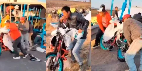 VIDEO. Mientras equipo rescata a chofer de tráiler accidentado, pobladores  realizan rapiña con motos 